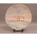 Early 20th Century hand painted pottery charger, decorated with a scene depicting the paddle steamer