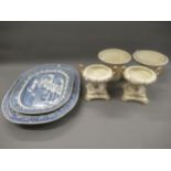 Two 19th Century blue and white transfer printed willow pattern meat dishes, together with a pair of