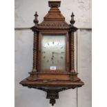 Victorian oak Gothic revival bracket clock with bracket, the silvered dial inscribed Howell