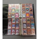 Two albums containing large quantity of Yu-Gi-Oh! cards