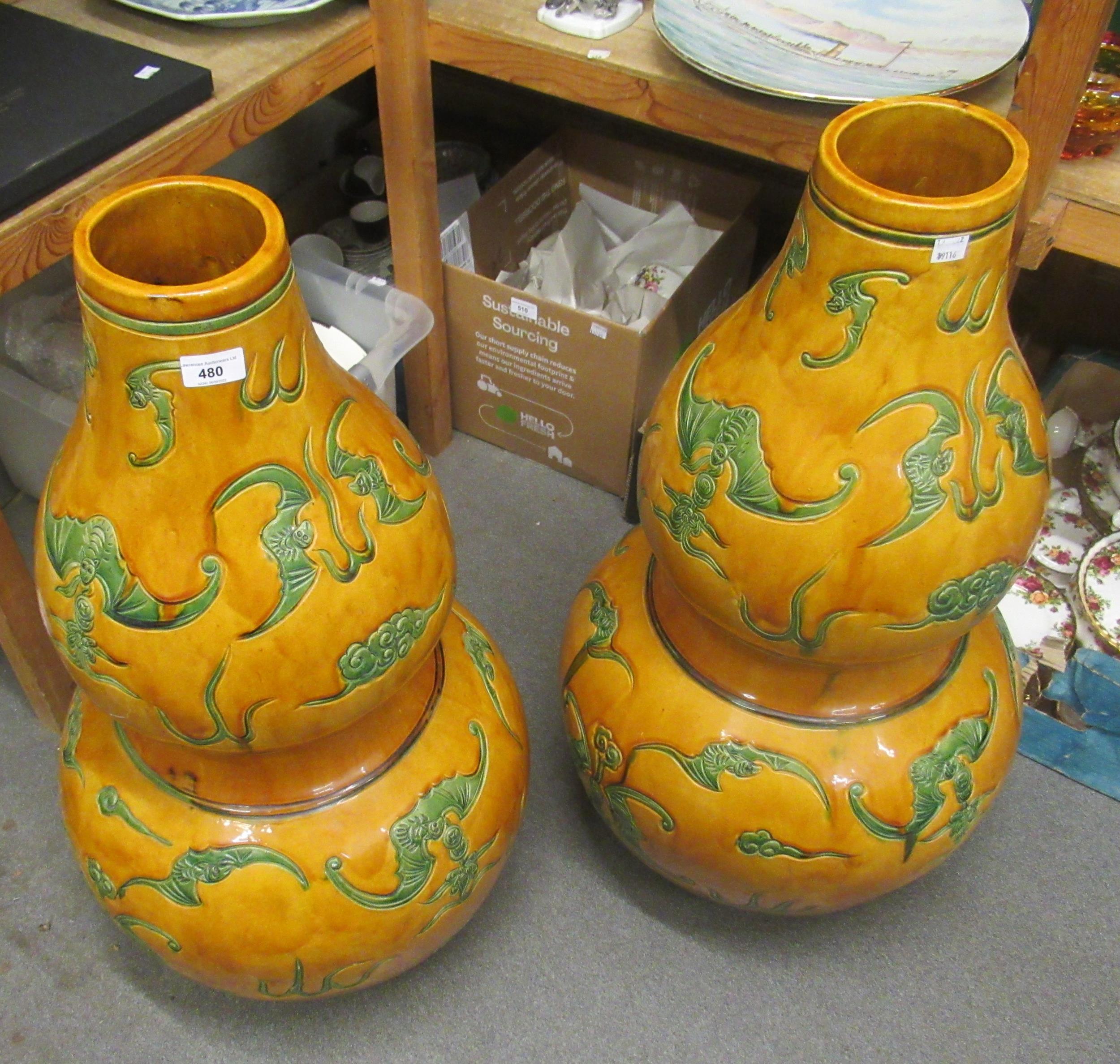 Pair of large 20th Century Chinese pottery gourd shaped vases, decorated with bats in green on a