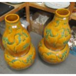 Pair of large 20th Century Chinese pottery gourd shaped vases, decorated with bats in green on a