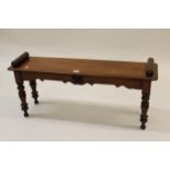 Victorian mahogany hall bench / window seat, the turned end handles above a plank seat, shaped