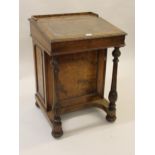 Victorian walnut Davenport with hinged sloping leather inset writing surface enclosing a maple lined