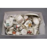 Small box containing a collection of various crested china, including Goss