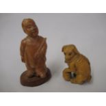 Japanese carved boxwood netsuke in the form of a dog, together with a carved boxwood figure of a