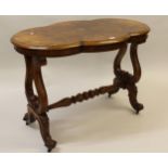 Victorian burr walnut shaped centre table with moulded top and plain frieze, raised on twin carved