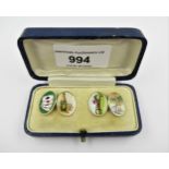 Pair of 18ct Gold and enamel cufflinks, decorated with playing cards, champagne bottle, huntsman