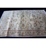 Afghan Ziegler type rug with an all-over palmette and floral design on an ivory ground with borders,