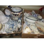 Two boxes containing a quantity of blue and white transfer printed dinner ware