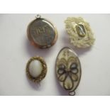 Three various Georgian memorial brooches, together with a similar mother of pearl leaf form brooch