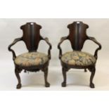 Attributed to Waring & Gillow, pair of late 19th Century mahogany tub shaped open elbow chairs