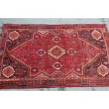 Shiraz carpet with a medallion and all-over floral design, 9ft x 7ft approximately