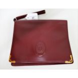 Must de Cartier bordeaux leather pouch, with authenticity card and dust bag