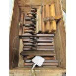 Wooden box containing a collection of various antique moulding planes