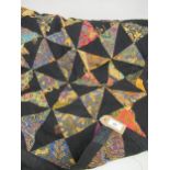 Modern patchwork table cover / bedspread worked with alternating black and polychrome triangles, 8ft