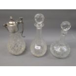 Cut glass claret jug with silver plated mounts, together with two cut glass decanters