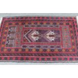 Afghan prayer rug with a twin medallion and Mihrab design on a dark ground with multiple borders,