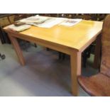 Modern rectangular light oak dining table on square supports, 55ins x 31ins