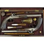 Cased pair of 19th Century Continental target pistols with percussion action, damascene barrels