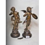 Pair of late 19th Century bronze patinated spelter figures of cherubs, 13ins high