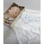 Flamingo feather floral headdress with original box, together with a small quantity of linen