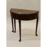 Small 18th Century mahogany half round fold-over tea table on tapering supports with pad feet, 29ins