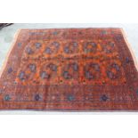 Afghan rug with two rows of five gols on a rust ground with multiple border, 6ft 2ins x 5ft