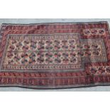 Belouch prayer rug with a Mihrab design in shades of iron red, dark blue and beige, 5ft 2ins x 2ft