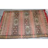 Soumak rug of polychrome panel and banded design in shades of red, pale blue, cream and yellow,