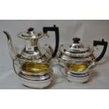 Four piece silver tea service, including a rectangular baluster form coffee pot, London 1932, 68