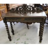 19th Century carved oak hall table, the pierced galleried back with central shield and mythical