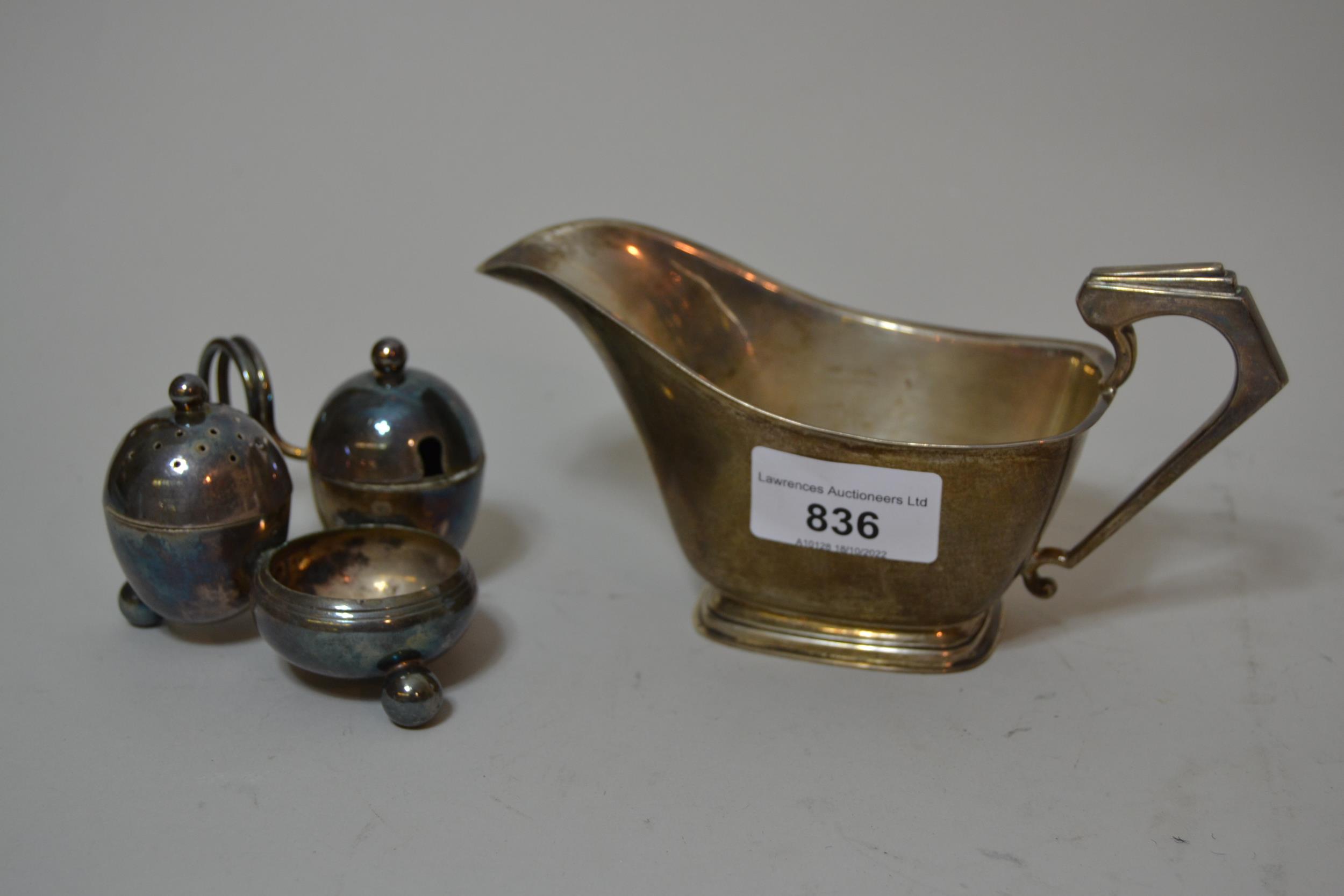 Birmingham silver 1920's cream jug and a plated cruet set