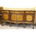 Gillows of Lancaster, mid 20th Century figured walnut semi bow front sideboard, the carved moulded