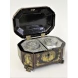 19th Century chinoiserie two division tea caddy decorated with figures on low carved supports, the