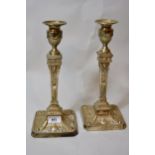 Pair of Victorian silver candlesticks in Adam style, relief decorated with swags, rams heads and