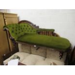Victorian carved mahogany and green button upholstered chaise longue, the shaped back above an