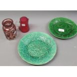 Green glazed Burlslem leaf form plate and another smaller leaf form plate, cranberry glass jug and a