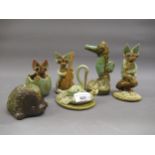 Yare pottery figure of a stork delivering a baby dragon, together with five other similar items
