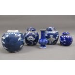 Group of four small 20th Century blue and white prunus blossom ginger jars (three with covers),