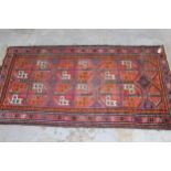 Small Afghan rug with two rows of three gols on a wine ground with borders, 6ft x 3ft 2ins