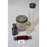 Double-ended ruby glass scent bottle, two other scent bottles and two silver mounted glass