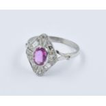 Platinum Deco style ring set with a single oval pink sapphire surrounded by diamonds, size 0