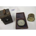 Brass cased barometer with silvered dial in fitted box, small brass drum clock and a boxed Brownie