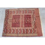 Turkoman prayer rug with a twin panel Mihrab design on a wine ground with borders and skirt panel,