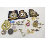 Bag containing a quantity of assorted military cap badges, including some Third Reich items and an