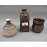 Two studio pottery vases, bearing signatures and a glazed studio pottery beaker, bearing initials