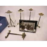 Group of four French gilt metal mounted glass photograph frames, together with a similar stand and