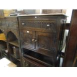 20th Century oak side cabinet with single drawer, above two panelled doors on turned supports with