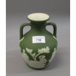 Wedgwood green jasperware two handled baluster form vase, a copy of the Portland vase, 6.75ins